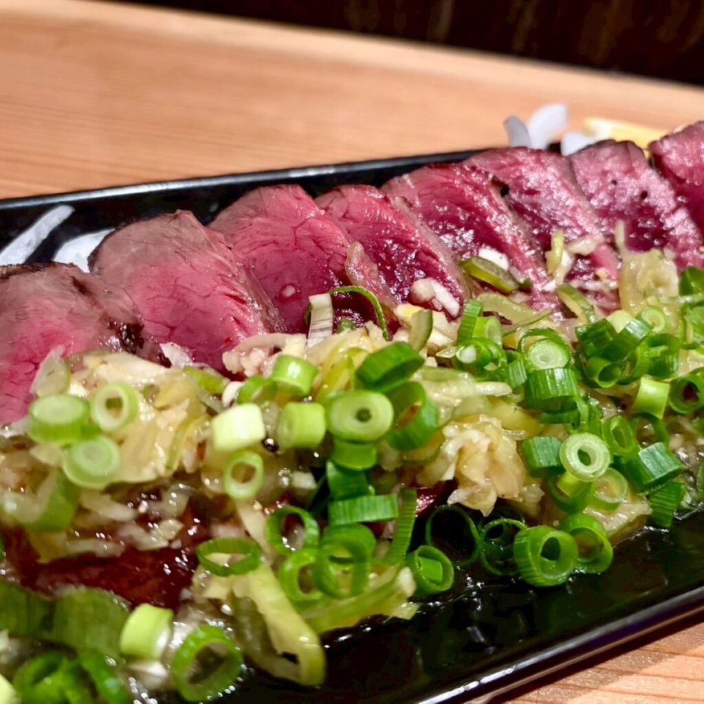 神栖市の居酒屋「めし呑み処 ラクロード」メニュー「ハツのネギまみれ」